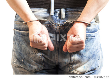 Close up of man in handcuffs arrested isolated on Close up of man in handcuffs arrested isolated on 63402356