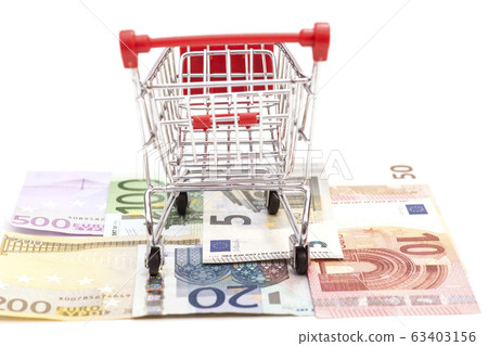 shopping cart on euro banknotes isolated shopping cart on euro banknotes isolated 63403156