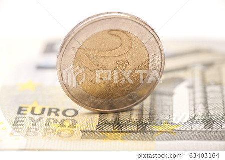 2 euro coins on banknotes 2 euro coins on banknotes 63403164