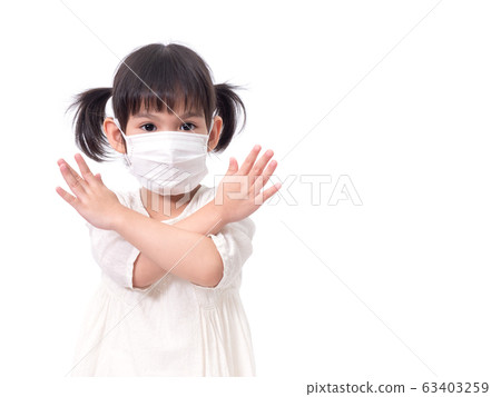 Asian little cute girl 4 years old wearing a hygienic face mask to protective spread the disease on white background. Prevention of spreading the corona virus COVID-19 cold flu or pollution. 63403259