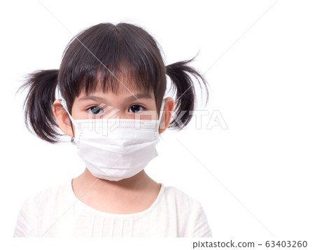 Asian little cute girl 4 years old wearing a hygienic face mask to protective spread the disease on white background. Prevention of spreading the corona virus COVID-19 cold flu or pollution. 63403260