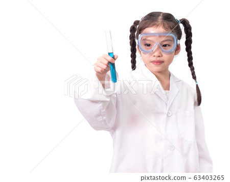 Little asian cute girl 6 years old role playing a scientist in science lab with equipment and looking at liquid chemicals in tube. Learning and education of kid. Little asian cute girl 6 years old role playing a scientist in science lab with equipment and looking at liquid chemicals in tube. Learning and education of kid. 63403265