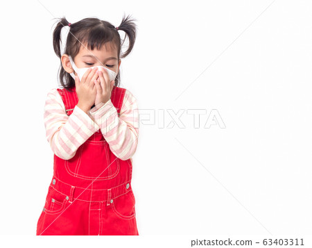 Asian little cute girl 4 years old wearing a hygienic mask and covering  mouth with her hands to protection spread the virus, cold flu or pollution on white background. 63403311
