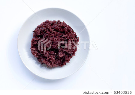Black sticky rice on white ceramic dish isolated Black sticky rice on white ceramic dish isolated 63403836