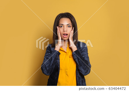 Shocked black woman. Surprised african American girl Shocked black woman. Surprised african American girl 63404472