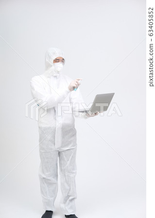 man wearing biological protective uniform suit man wearing biological protective uniform suit 63405852