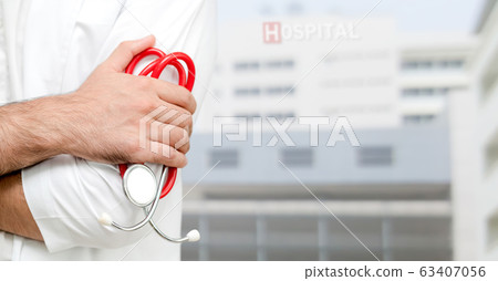 Young male doctor working at the hospital. Young male doctor working at the hospital. 63407056
