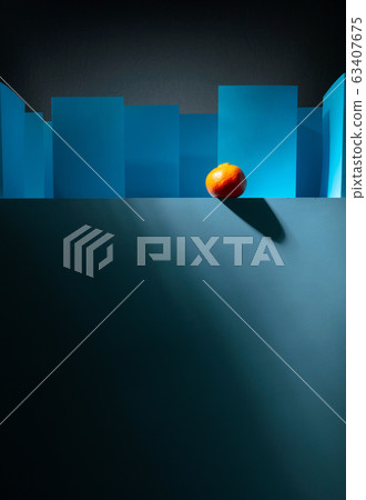 Tangerine in paper labyrinth. Concept of theme of 63407675