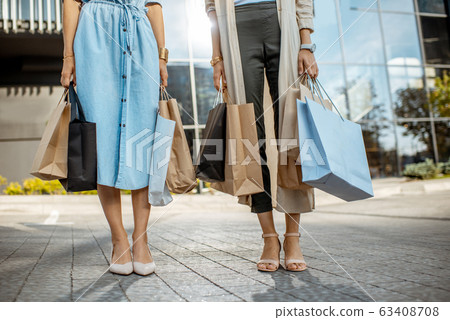 Women with shopping bags near the mall outdoors Women with shopping bags near the mall outdoors 63408708