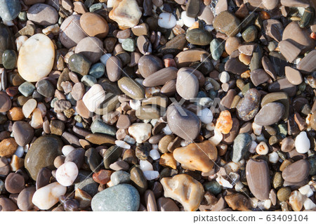 Sea pebble stones background beach rocks Sea pebble stones background beach rocks 63409104