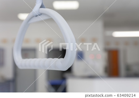 Hospital bed trapeze in intensive care unit Hospital bed trapeze in intensive care unit 63409214
