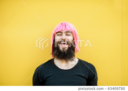 Man with color hair on the yellow background 63409780