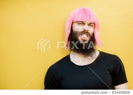 Man with color hair on the yellow background 63409809