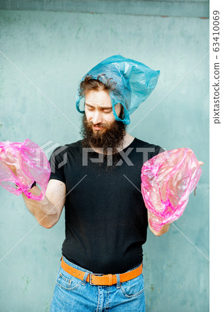 Conceptual portrait of a man with plastic bags Conceptual portrait of a man with plastic bags 63410069