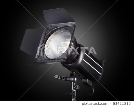Photography studio flash isolated on black background with lamp. 63411813