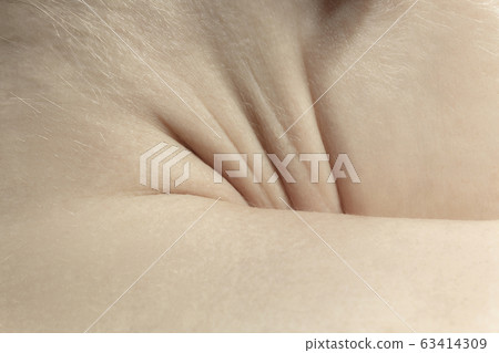 Texture of human skin. Close up of well-kept caucasian human body Texture of human skin. Close up of well-kept caucasian human body 63414309