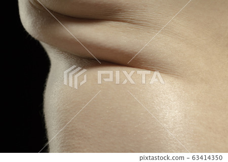 Texture of human skin. Close up of well-kept caucasian human body Texture of human skin. Close up of well-kept caucasian human body 63414350