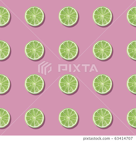 Colorful fruit pattern of fresh lime slices on pink background. 63414707