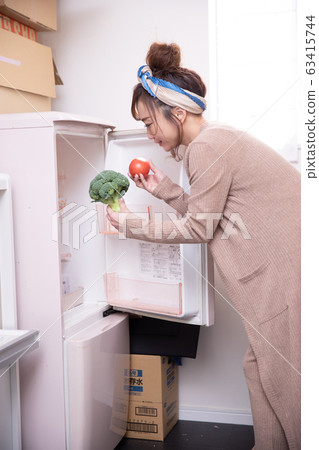 Woman in room wear Woman in room wear 63415744