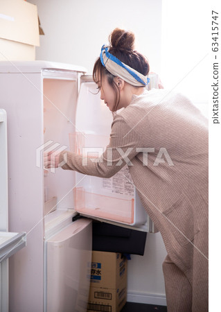 Woman in room wear Woman in room wear 63415747