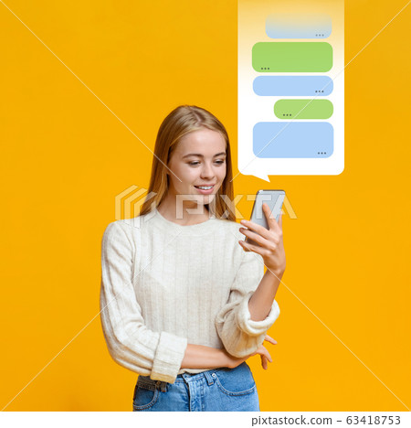 Chat service. Beautiful girl using social media messenger on orange background, blank space 63418753