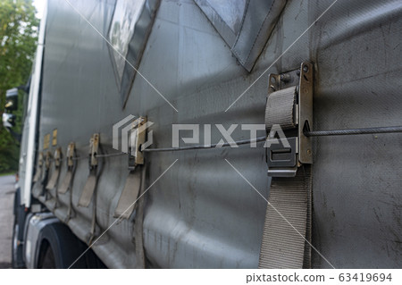 attaching the awning of the cargo trailer closeup 63419694