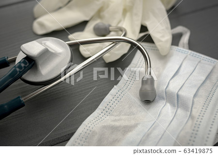 Stethoscope, latex gloves and face mask to protect 63419875