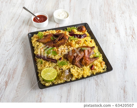 Arabic traditional food bowls Kabsa with meat. Arabic traditional food bowls Kabsa with meat. 63420507