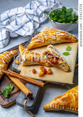 Puff pastry apple pastry turnovers for dessert. 63421558