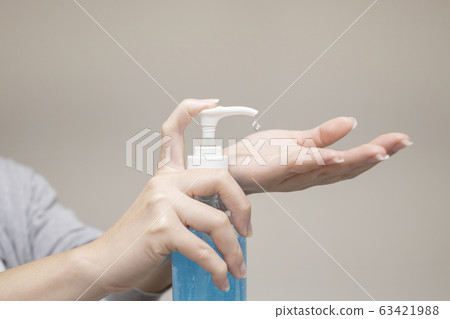 Woman Hand Pump Alcohol in order to Kill Germs for 63421988