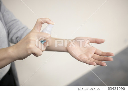Woman Hand Pump Alcohol Spray in order to Kill 63421990