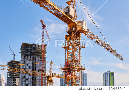 construction tower cranes on a building site 63422041