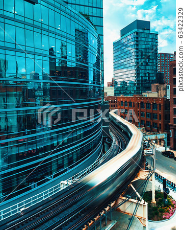 Elevated train curving through Chicago 63422329