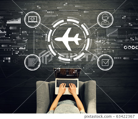 Flight ticket booking concept with person using a laptop Flight ticket booking concept with person using a laptop 63422367