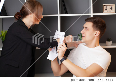 Angry woman has a conflict with the manager of the company 63423545