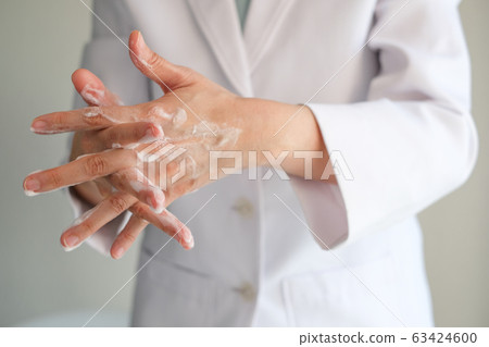 doctor wash hands with the foam soap to clean doctor wash hands with the foam soap to clean 63424600