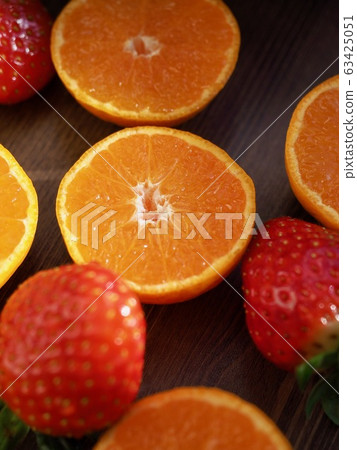 Fresh organic fruits strawberries, tangerines, pomegranates 63425051