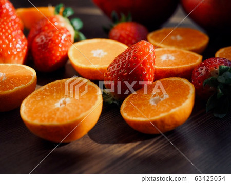 Fresh organic fruits strawberries, tangerines, pomegranates 63425054
