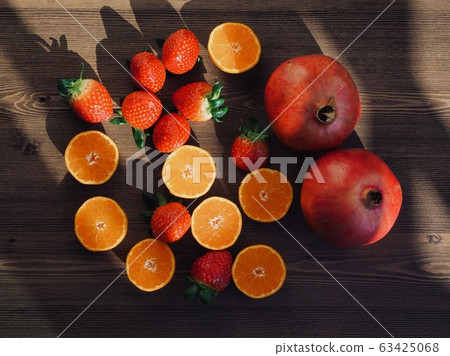 Fresh organic fruits strawberries, tangerines, pomegranates Fresh organic fruits strawberries, tangerines, pomegranates 63425068