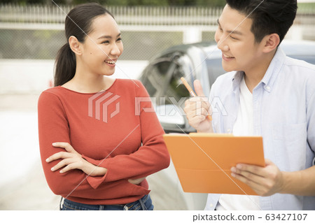 A woman receiving a skills training at a driving school A woman receiving a skills training at a driving school 63427107