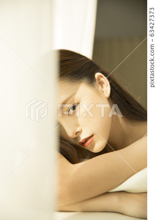Relaxing woman and sunshine Relaxing woman and sunshine 63427373