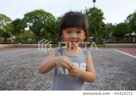 cute little asian girl smiling,friendly girl, positive female kid,happy girl	 63428152