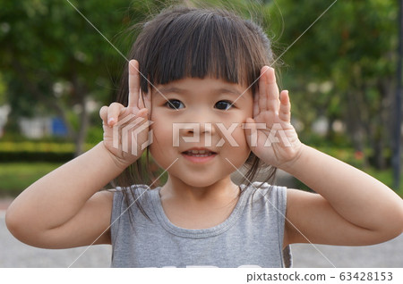 cute little asian girl smiling,friendly girl, positive female kid,happy girl	 63428153