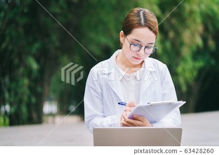 woman doctor, working, hospital woman doctor, working, hospital 63428260