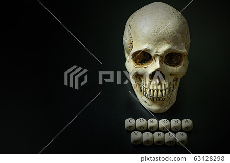 The corona virus  wooden cube and skull  on black background for medical content. 63428298