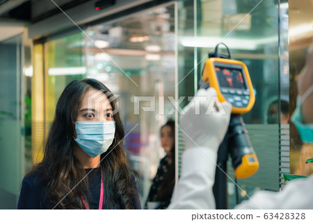 People waiting for temperature check by thermoscan 63428328