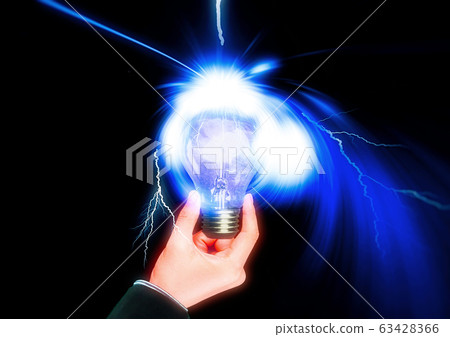Shining light bulb in hand Shining light bulb in hand 63428366