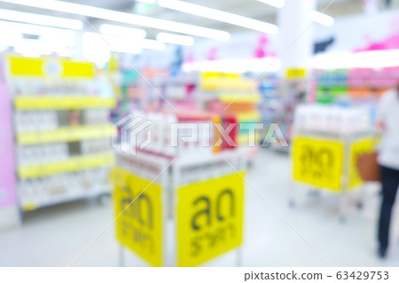 Bokeh blurred supermarket store with various goods 63429753