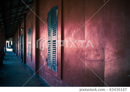 Old red building and old window Old red building and old window 63430187