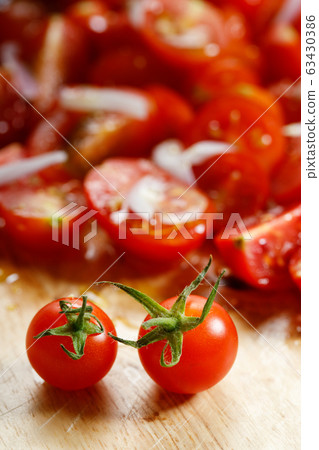 red cherry tomato on wooden background red cherry tomato on wooden background 63430386